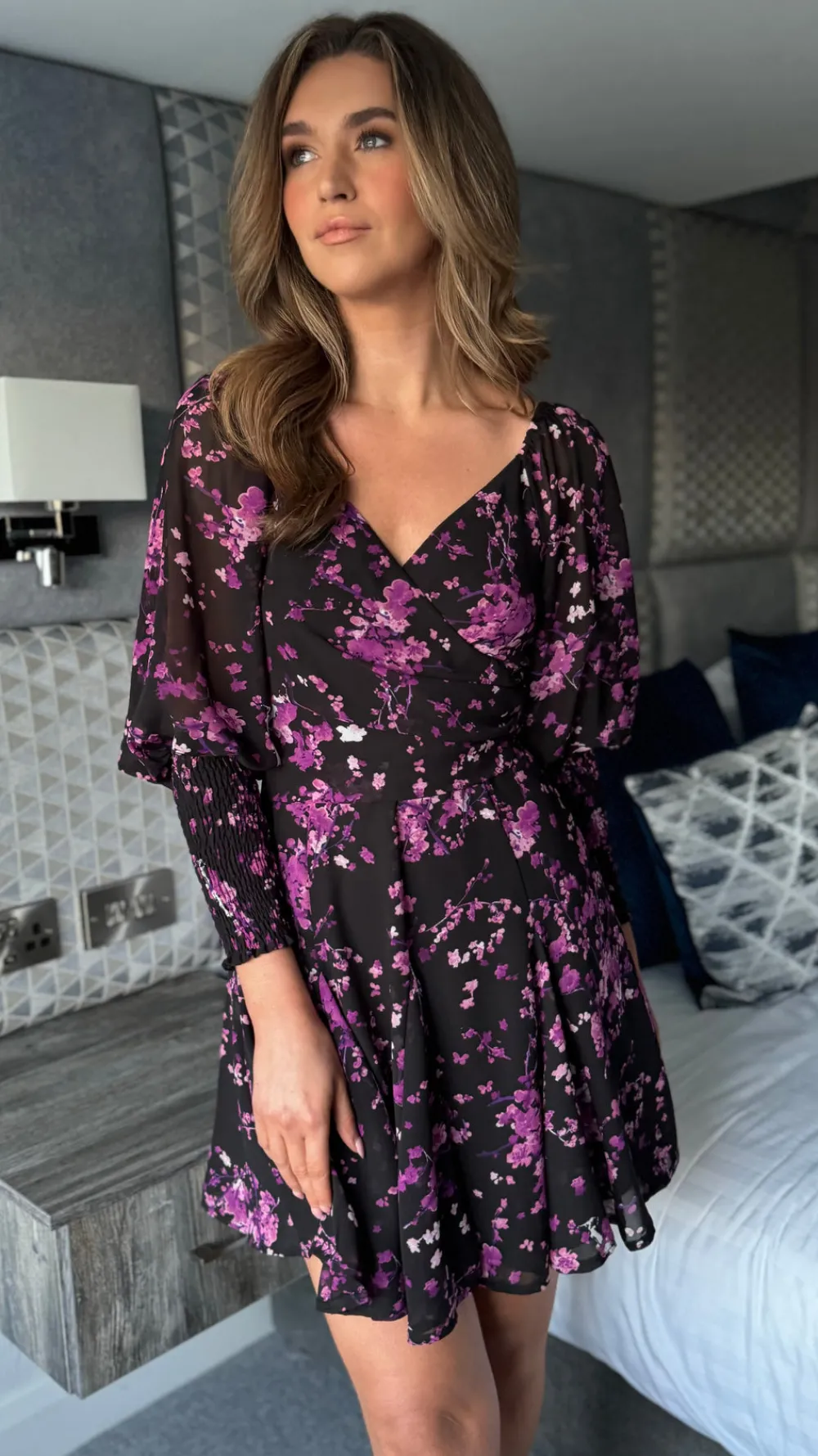 carole_purple_floral_wrap_4.webp GIRL IN MIND Day Dresses | Going Out Dresses^Carole Purple Floral Wrap Neck Puff Sleeve Skater Mini Dress